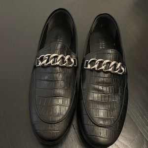 Barney’s black leather loafers with buckle